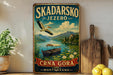A vintage-style metal sign for Skadarsko Jezero, featuring a boat on a lake surrounded by mountains and a bird in flight.