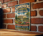 A vintage-style sign for Sonnenberg Gardens and Mansion, featuring a large illustration of a historic building surrounded by a well-manicured garden.