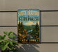 A vintage-style sign for South Bradford State Forest in New York, featuring a scenic landscape with pine trees, a river, and mountains.