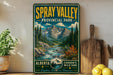 A vintage-style sign for Spray Valley Provincial Park in Alberta, Canada, featuring a scenic mountain landscape with a river and pine trees.