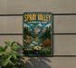 A vintage-style sign for Spray Valley Provincial Park in Alberta, Canada, featuring a mountain landscape with a river and pine trees.