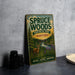 A vintage metal sign for Spruce Woods Provincial Park, Manitoba, featuring a deer and a forest landscape.