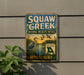 A vintage-style metal sign for Squaw Creek National Wildlife Refuge in Missouri, featuring a blue sky, water, and birds.
