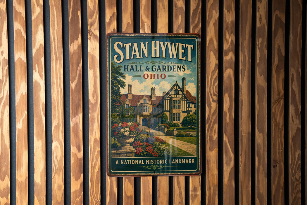 A vintage metal sign for "Stan Hywet Hall & Gardens" in Ohio, featuring a picture of a historic building surrounded by gardens.