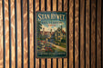 A vintage metal sign for "Stan Hywet Hall & Gardens" in Ohio, featuring a picture of a historic building surrounded by gardens.