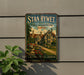 A vintage-style sign for "Stan Hywet Hall & Gardens" in Ohio, featuring a large illustration of a historic building surrounded by gardens.