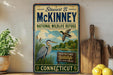A vintage-style sign for Stewart B. McKinney's National Wildlife Refuge in Connecticut, featuring illustrations of birds and a river.