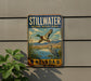 A vintage-style metal sign for Stillwater National Wildlife Refuge in Nevada, featuring a bird in flight and a bird standing in the water.