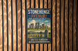 A vintage-style metal sign for Stonehenge, Avebury, and associated sites, mounted on a wooden wall.