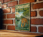 A vintage-style metal sign for Sundarbans National Park in India, featuring an illustration of a tiger in a natural setting.