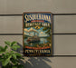 A vintage-style sign for Susquehanna National Heritage Area, featuring a steamboat and a scenic landscape, mounted on a wall.