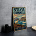 A vintage-style sign for Sylvia Grinnell Territorial Park, featuring a mountain landscape with a ram in the foreground.