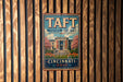 A vintage metal sign for the Taft Museum of Art in Cincinnati, Ohio, featuring an illustration of the museum building surrounded by flowers.