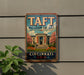 A vintage metal sign for the Taft Museum of Art in Cincinnati, Ohio, featuring a building with a large archway and surrounded by flowers.