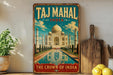 A vintage-style poster of the Taj Mahal in India, featuring the iconic white marble mausoleum and its reflection in a pool.