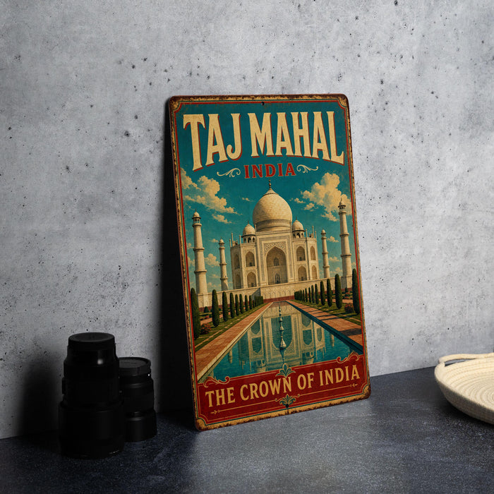 A vintage-style metal sign with the text "Taj Mahal India" and an illustration of the Taj Mahal, a famous mausoleum in India.