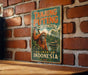 A vintage-style metal sign for Tanjung Puting National Park in Kalimantan, Indonesia, featuring an illustration of an orangutan and a boat on a river.