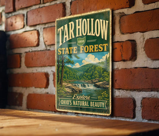 A vintage-style metal sign for the Tar Hollow State Forest in Ohio, featuring a scenic landscape with a waterfall and forest.