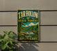 A vintage-style sign for the Tar Hollow State Forest in Ohio, featuring a scenic landscape with a waterfall and forest.