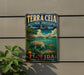 A vintage-style metal sign for Terra Ceia Aquatic Preserve, featuring an illustration of a manatee and other marine life, with the text "Terra Ceia Aquatic Preserve" and "Florida" prominently displayed.