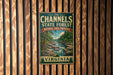 A vintage-style metal sign for the Channels State Forest in Virginia, featuring a scenic landscape with a river and forest.