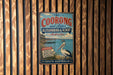 A vintage metal sign for "The Coorong and Lakes" in Australia, featuring a large white bird and text promoting the area's natural beauty, wildlife, and tranquility.