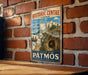 A vintage metal sign for the Historic Centre in Patmos, Greece, featuring a scenic image of the island's architecture and landscape.