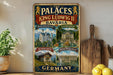 A vintage-style metal sign displaying the palaces of King Ludwig II of Bavaria, including Neuschwanstein Castle, Linderhof, Schachen, and Herrench im See, with illustrations of the buildings and landscapes.