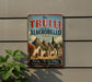 A vintage-style sign for "The Trulli of Alberobello, Italy", featuring a picture of a village with traditional Italian architecture.