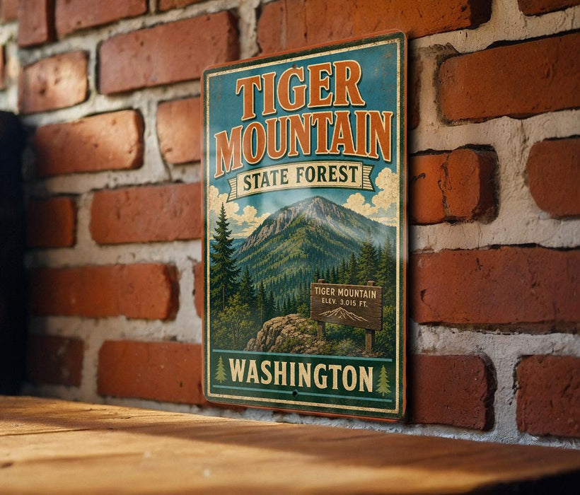 A vintage-style metal sign for Tiger Mountain State Forest in Washington, featuring a mountain landscape and a sign indicating the location.