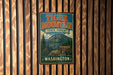 A vintage metal sign for Tiger Mountain State Forest in Washington, featuring a mountain landscape and the text "Tiger Mountain State Forest Washington".