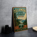 A vintage-style metal sign for Tillamook State Forest in Oregon, featuring a scenic landscape with pine trees and mountains.