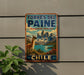 A vintage-style metal sign with a llama and mountains in the background, mounted on a wall.