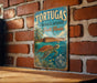 A vintage-style metal sign with the text "TORTUGAS ECOLOGICAL RESERVE South Florida" and an illustration of a turtle swimming in the ocean.