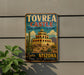 A vintage-style metal sign for Tovrea Castle, a desert treasure in Arizona, featuring a colorful illustration of the castle and desert landscape.
