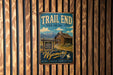 A vintage-style metal sign for Trail End State Historic Site in Wyoming, featuring a cabin and mountains in the background.