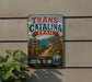 A vintage metal sign for the Trans-Catalina Trail in California, featuring a scenic landscape with mountains, a winding path, and a signpost.