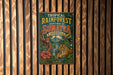 A vintage metal sign with the text "TROPICAL RAINFOREST HERITAGE OF SUMATRA INDONESIA" is displayed on a wooden wall.