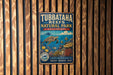 A vintage-style metal sign for Tubbataha Reefs Natural Park in the Philippines, featuring an illustration of a sea turtle and various marine life.