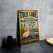 A vintage-style metal sign for Tule Lake National Wildlife Refuge in California, featuring an illustration of a duck and a mountain landscape.
