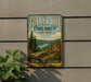 A vintage metal sign for Tulter Hill State Forest in New York, featuring a scenic landscape with pine trees, a lake, and mountains.