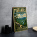 A vintage-style metal sign for Tuscarora State Forest in Pennsylvania, featuring a scenic landscape with mountains, trees, and a winding river.