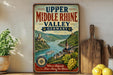 A vintage-style sign for Upper Middle Rhine Valley, Germany, featuring a scenic illustration of the valley with a river, castle, and grapes.