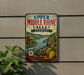 A vintage-style metal sign with the text "Upper Middle Rhine Valley Germany" and a scenic illustration of a river, hills, and buildings.