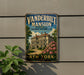 A vintage-style metal sign for the Vanderbilt Mansion, a National Historic Site in New York, with a large illustration of the mansion and a path leading to it.