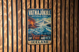 A vintage metal sign for Vatna Jokull National Park, featuring a scenic image of a volcano and ice-covered mountains.