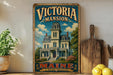 A vintage-style metal sign for "Victoria mansion" in Maine, featuring an illustration of a large, ornate Victorian-style mansion surrounded by trees and flowers.