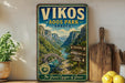 A vintage-style sign for Vikos Aoos Park in Greece, featuring a scenic mountain landscape with a bridge and river.