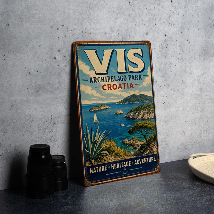 A vintage-style metal sign with a coastal scene and a sailboat, advertising the Archipelago Park in Croatia.