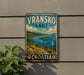 A vintage-style metal sign displaying the name "Vranksko Lake" and the word "Crotia" in Croatia, with a scenic image of the lake and mountains in the background.